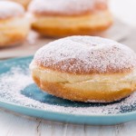 Traditional German Krapfen, Berliner or donuts with icing sugar