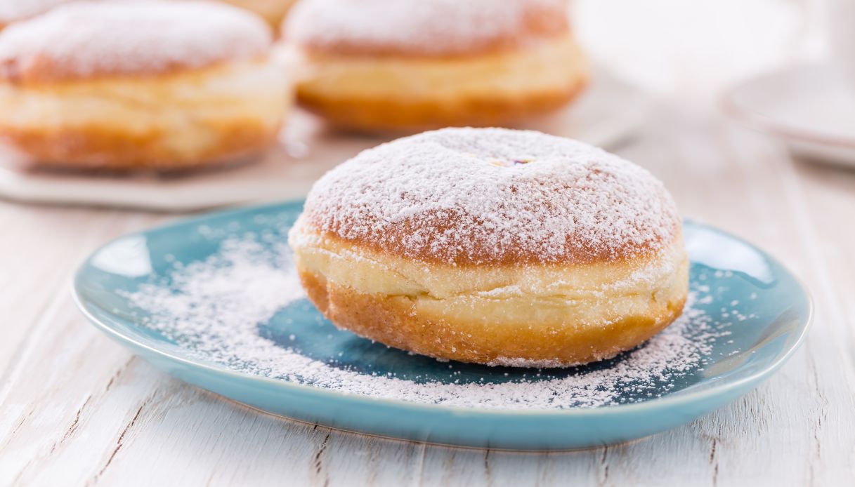 Traditional German Krapfen, Berliner or donuts with icing sugar